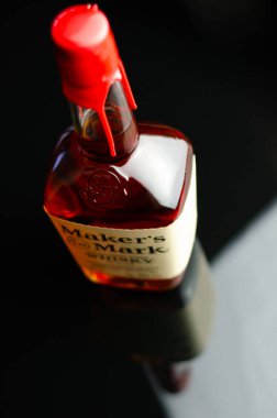 LONDON, UNITED KINGDOM - JULY 24, 2022 The original Maker's Mark in a characteristic squarish bottle sealed with red wax, famous American whisky