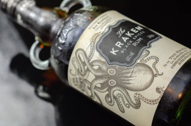 LONDON, UNITED KINGDOM - FEBRUARY 1, 2022 Bottle of The Kraken black rum, alcohol blended with a mix of 11 spices, spirit from Trinidad, Caribbean clipart