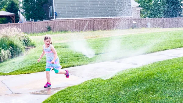 Little Girl Playing Sprinkles Hot Summer Day — Stock Photo, Image