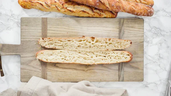 Flat lay. Freshly baked homemade French baguette bread.