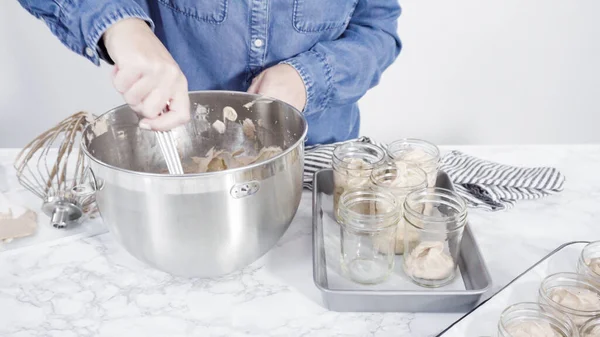 stock image Step by step. Scooping homemade chocolate ice cream into glass jars.