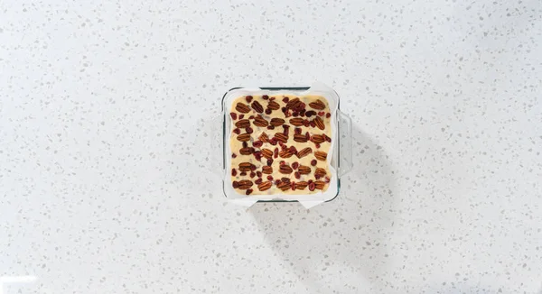 Flat Lay Removing White Chocolate Cranberry Pecan Fudge Baking Pan — Stock Photo, Image