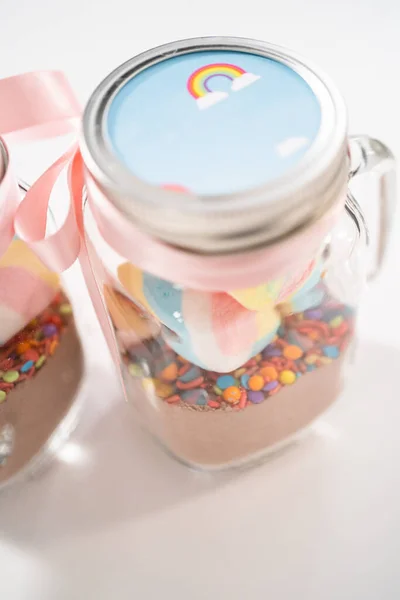 stock image Making unicorn hot chocolate mix in drinking mason jar as a food gift.