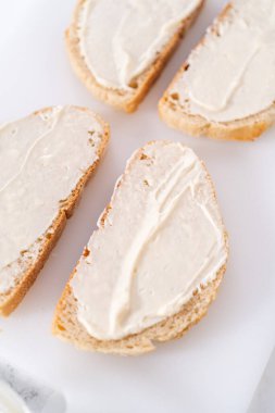 Prepare provolone and apple grilled cheese sandwich.