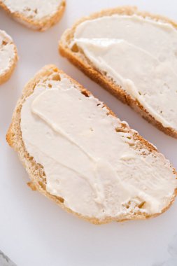 Prepare provolone and apple grilled cheese sandwich.