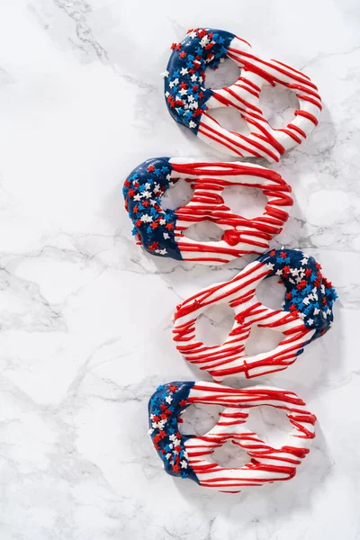 American flag. Red, white, and blue chocolate-covered pretzel twists.