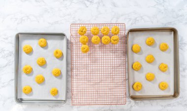 Lemon Cookies with White Chocolate. Flat lay. Cooling freshly baked lemon cookies with white chocolate on a kitchen counter.