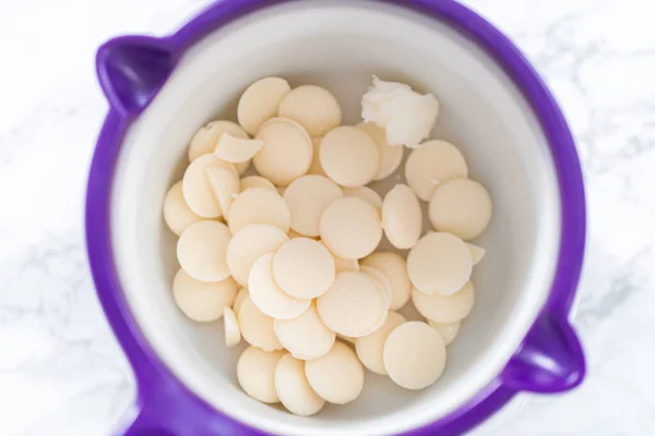 stock image Melting white chocolates to make white chocolate stars.