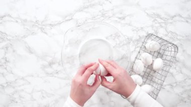Time lapse. Flat lay. Mixing ingredients in a glass mixing bowl for spinach and ham frittata.