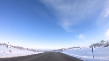 Time lapse. Driving on a rural road in American suburbs on Winter morning.