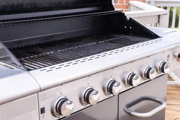 Clean six-burner gas grill ready for summer grilling.