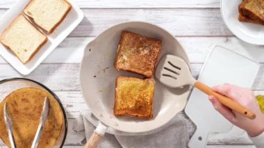 Time lapse. Step by step. Frying french toast in a nonstick frying pan.