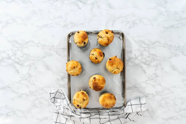 stock image Cooling freshly baked mini Easter bread kulich on a kitchen counter.