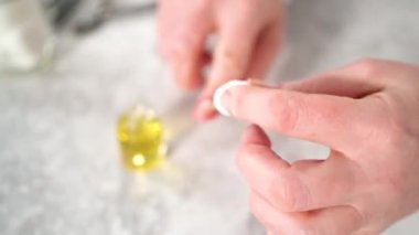 Time lapse. Woman finishing her manicure at home with simple manicure tools. Cutting out cuticles around the nails.