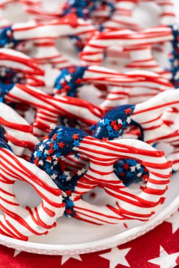 American flag. Red, white, and blue chocolate-covered pretzel twists.
