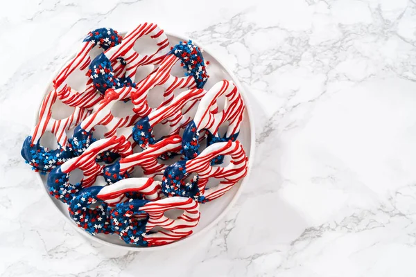 American Flag Red White Blue Chocolate Covered Pretzel Twists — 스톡 사진