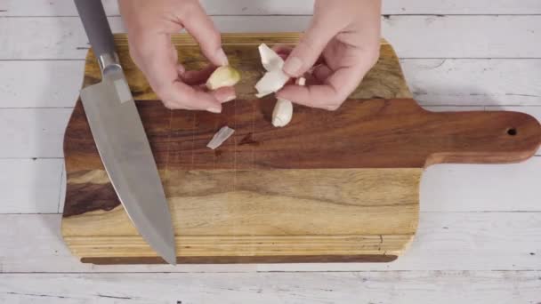 Time Lapse Mincing Organic Garlic Wood Cutting Board — Stock Video