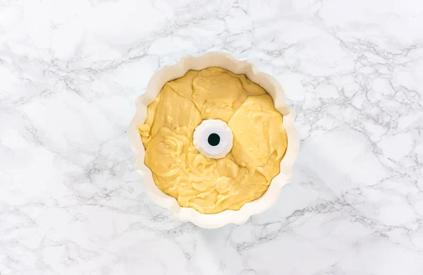 stock image Flat lay. Cake batter in bundt cake pan ready for baking.