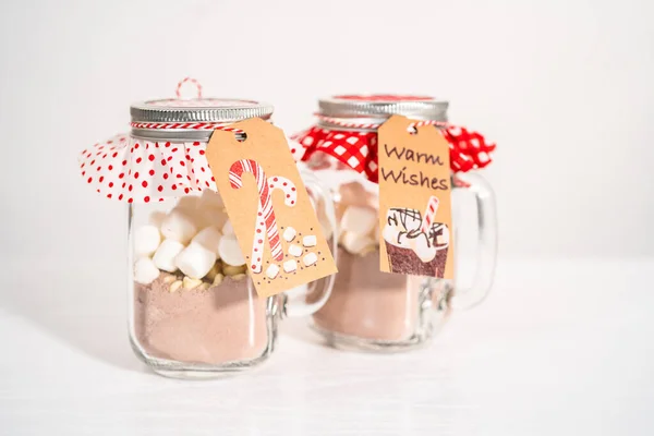 stock image Making homemade hot chocolate mix in drinking mason jar for Christmas food gift.