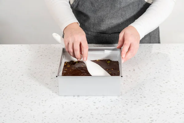Filling Square Cheesecake Pan Lined Parchment Paper Fudge Mixture Prepare — Stock fotografie