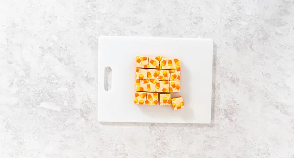 Homemade Candy Corn Fudge Square Pieces White Cutting Board — Stock Photo, Image