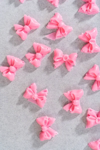 Preparing Pink Chocolate Bows Decorate Panda Shaped Shortbread Cookies — Stock Photo, Image