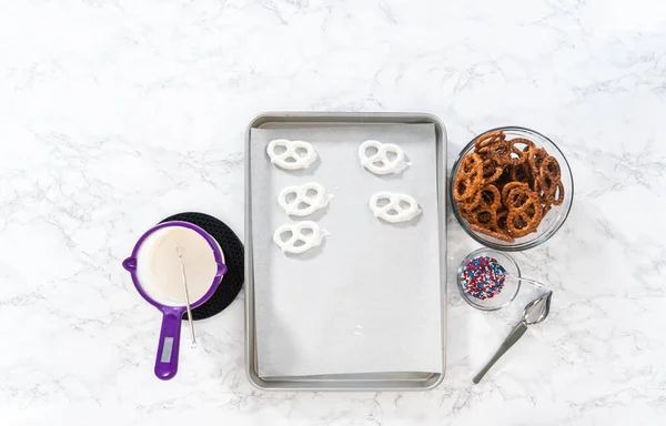 Flat Lay Dipping Pretzels Twists Melted Chocolate Make Red White — Zdjęcie stockowe