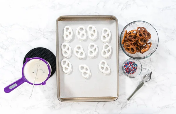 Flat Lay Dipping Pretzels Twists Melted Chocolate Make Red White — Photo