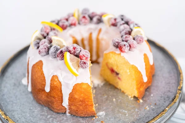 Sliced Lemon Cranberry Bundt Cake Decorated Sugar Cranberries Lemon Wedges — Stock Photo, Image