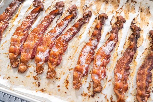 Cooked Bacon Strips Baking Sheet White Parchment Paper — Stock Photo, Image