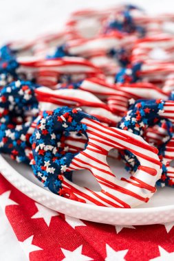 American flag. Red, white, and blue chocolate-covered pretzel twists.