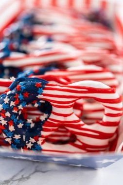 American flag. Red, white, and blue chocolate-covered pretzel twists.