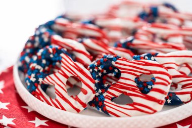 American flag. Red, white, and blue chocolate-covered pretzel twists.