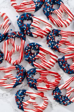 American flag. Red, white, and blue chocolate-covered pretzel twists.