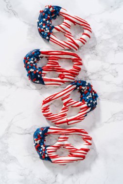 American flag. Red, white, and blue chocolate-covered pretzel twists.