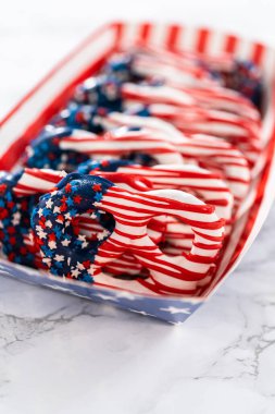 American flag. Red, white, and blue chocolate-covered pretzel twists.