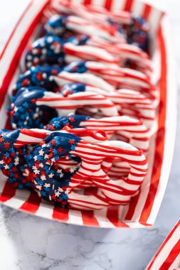 American flag. Red, white, and blue chocolate-covered pretzel twists.
