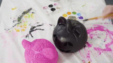 Time lapse. Painting craft pumpkin with acrylic paint for Halloween.
