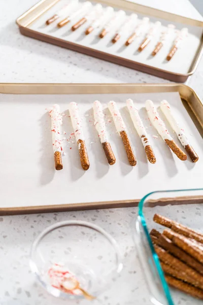 Homemade Candy Cane Chocolate Covered Pretzel Rods Drying Baking Sheet — Stock Photo, Image
