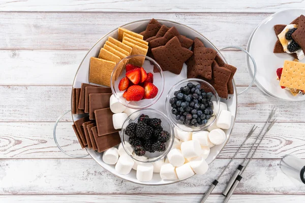 Arranging Fruit Smores Charcuterie Board White Tray — стоковое фото