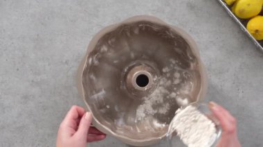 Time lapse. Flat lay. Step by step. Greasing bundt cake pan to bake lemon cranberry bundt cake.
