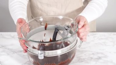 Mixing ingredients in kitchen mixer to bake a chocolate cupcake.