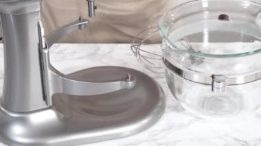 Time lapse. Whipping chocolate ganache with an electric kitchen mixer.