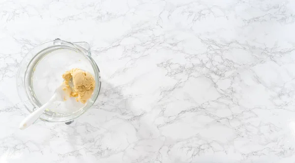 stock image Flat lay. Wrapping cookie dough into cellophane wrap to transfer into the refrigerator for chilling.