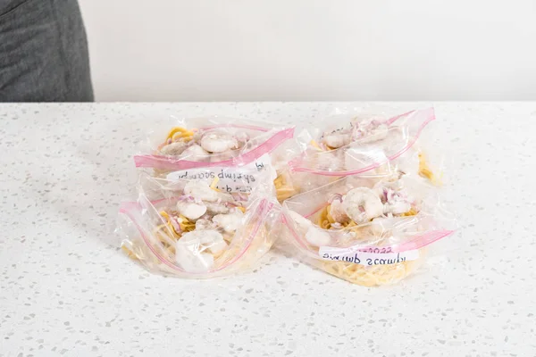 Packaging Homemade Frozen Shrimp Scampi Meal Prep Plastic Resealable Bags — Stock Photo, Image