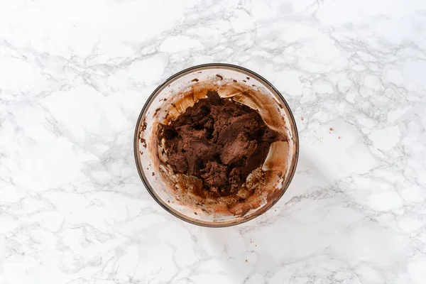 stock image Flat lay. Mixing ingredients with a hand mixer to bake chocolate cookies with chocolate hearts for Valentines Day.