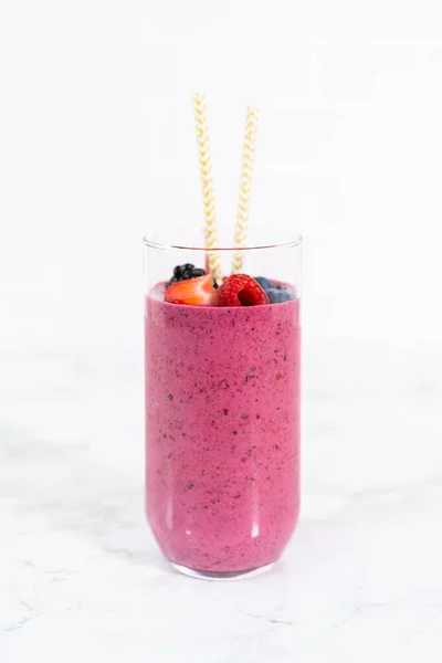 Freshly Made Mixed Berry Smoothie Garnished Fresh Berries Paper Straws — Foto de Stock