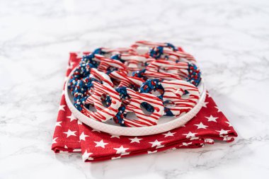 American flag. Red, white, and blue chocolate-covered pretzel twists.