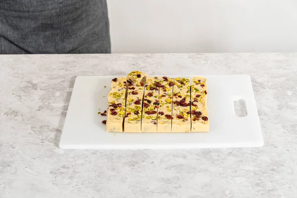 Cutting Cranberry Pistachio Fudge Large Kitchen Knife Square Pieces White — Stock Photo, Image