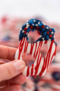 American flag. Red, white, and blue chocolate-covered pretzel twists.